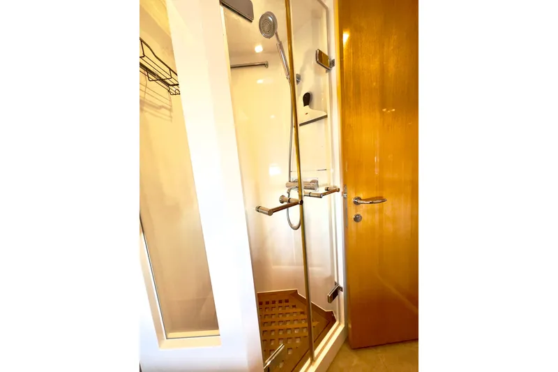 Slide: The Image of Luxurious shower in 2011 Horizon E88 yacht, featuring modern fixtures and wooden accents. - 50