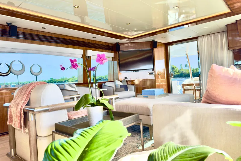 Slide: The Image of Luxurious interior of 2011 Horizon E88 yacht with elegant decor and vibrant orchids. - 54