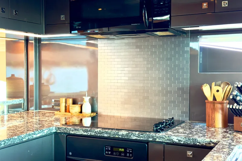 Slide: The Image of Modern kitchen with granite countertops, stainless steel appliances, and stylish backsplash on Horizon E88 yacht. - 67
