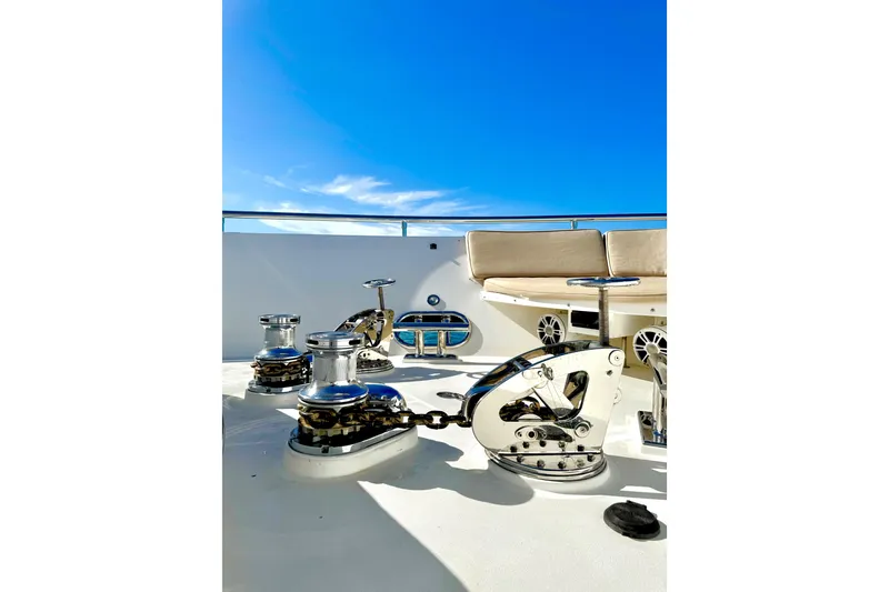 Slide: The Image of Deck of 2011 Horizon E88 yacht with winches and seating under clear blue sky. - 68