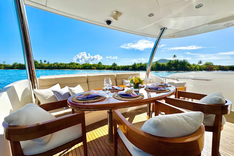 Slide: The Image of Luxurious dining setup on Horizon E88 yacht, 2011 model, with scenic ocean view. - 76
