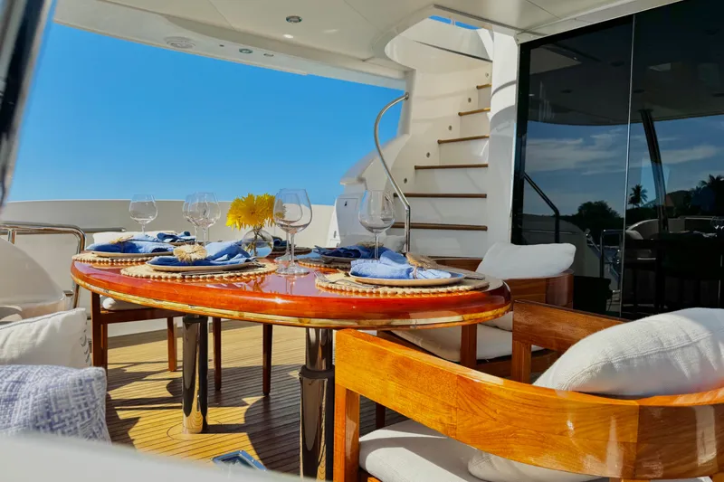 Slide: The Image of Luxurious dining setup on 2011 Horizon E88 yacht deck, featuring elegant tableware and ocean view. - 78