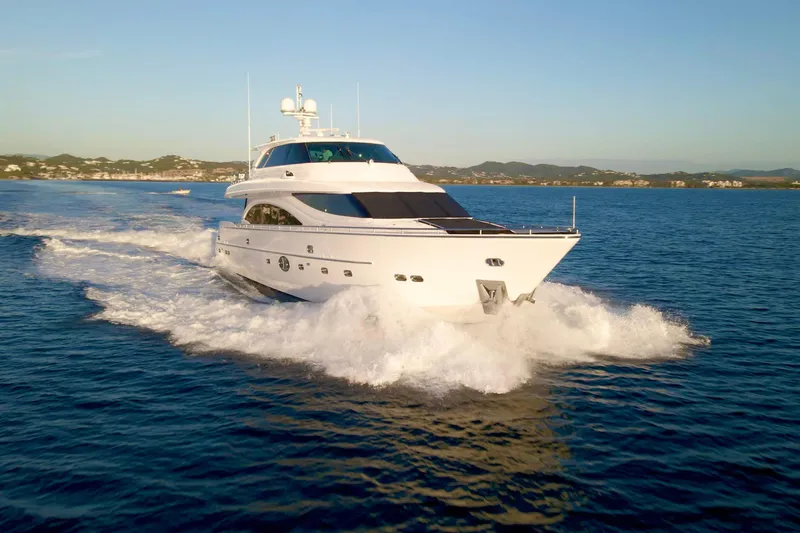 Slide: The Image of Luxurious 2011 Horizon E88 yacht cruising on open sea at sunset. - 8