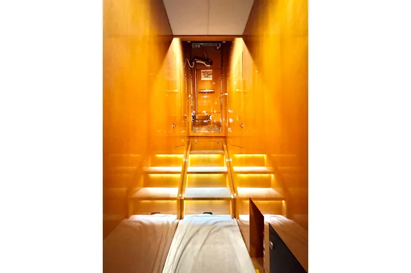 Slide: The Image of Luxurious interior of 2011 Horizon E88 yacht with illuminated wooden staircase. - 84