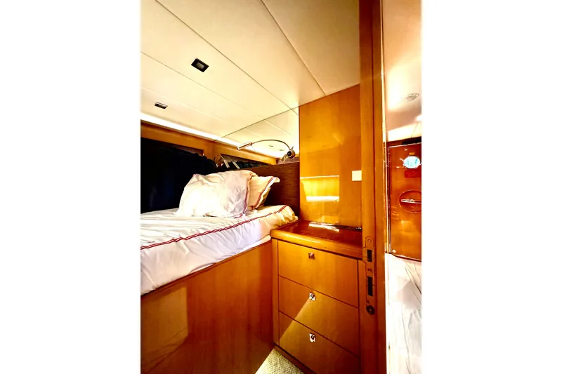 Slide: The Image of Luxurious cabin interior of 2011 Horizon E88 yacht with wooden furnishings and cozy bedding. - 86