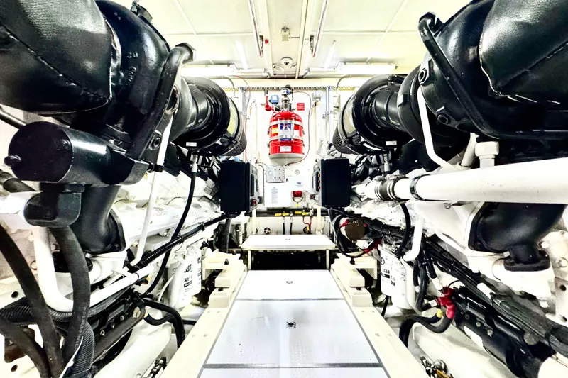 Slide: The Image of Engine room of 2011 Horizon E88 yacht, featuring dual engines and fire suppression system. - 89