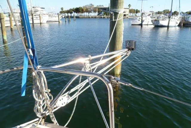 Slide: The Image of Sailboat docked in marina, Gozard 31 model, 1996, with clear blue water. - 16