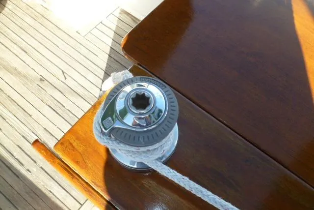 Slide: The Image of Winch on Gozard 31 sailboat, 1996 model, with rope on wooden deck. - 20