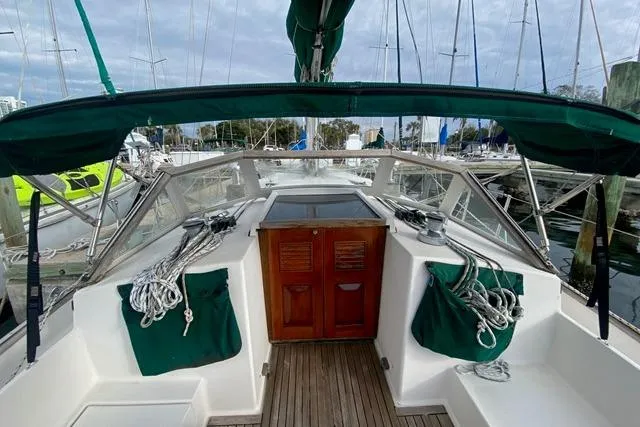 Slide: The Image of Sailboat cockpit view, Gozard 31 model, 1996, with green canopy and ropes. - 21