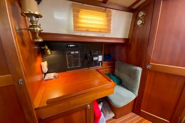 Slide: The Image of Cozy wooden interior of 1996 Gozard 31 boat with navigation station and seating. - 25
