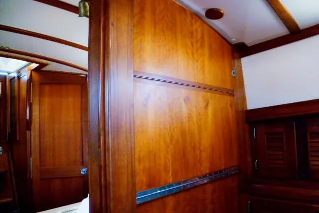 Slide: The Image of Interior of a 1996 Gozard 31 boat with polished wooden paneling. - 30