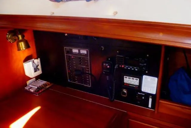 Slide: The Image of Control panel of a 1996 Gozard 31 boat with communication equipment. - 35