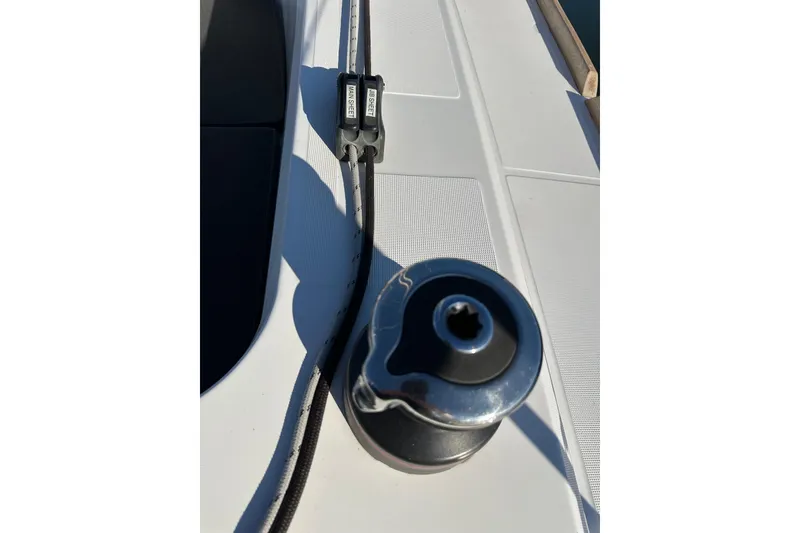 Slide: The Image of Winch and rope on Jeanneau Sun Odyssey 349 sailboat deck, 2021 model. - 11