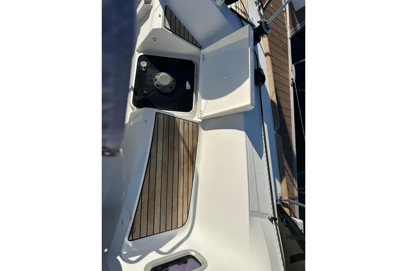 Slide: The Image of 2021 Jeanneau Sun Odyssey 349 deck with wood accents and sleek design. - 15