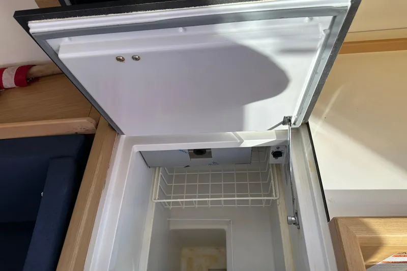 Slide: The Image of Open refrigerator in 2021 Jeanneau Sun Odyssey 349 yacht interior. - 38