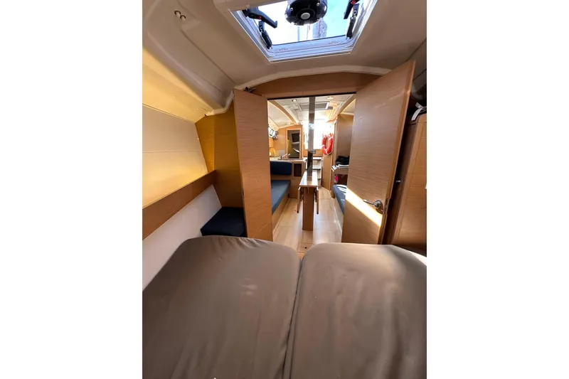 Slide: The Image of Interior of 2021 Jeanneau Sun Odyssey 349 sailboat, featuring modern wood finishes and seating. - 46