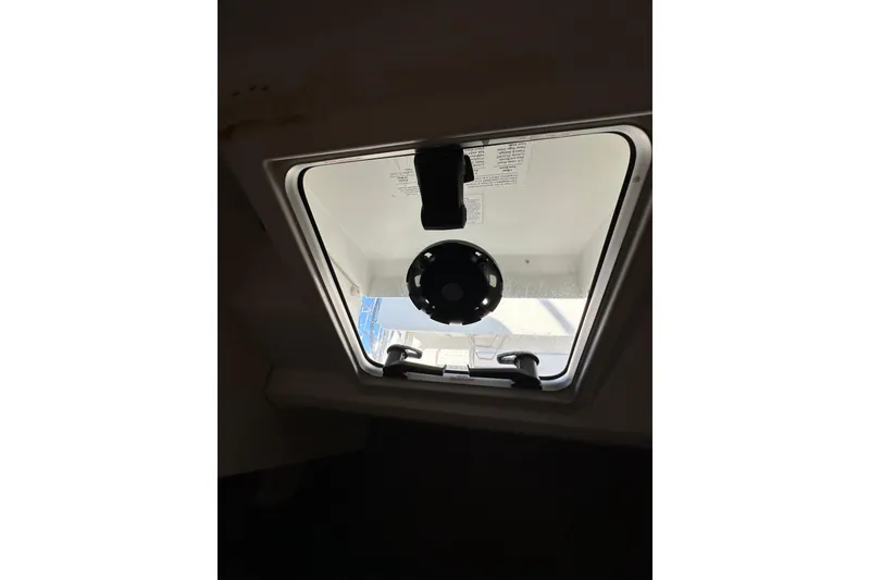 Slide: The Image of Hatch window of 2021 Jeanneau Sun Odyssey 349 sailboat, interior view. - 53