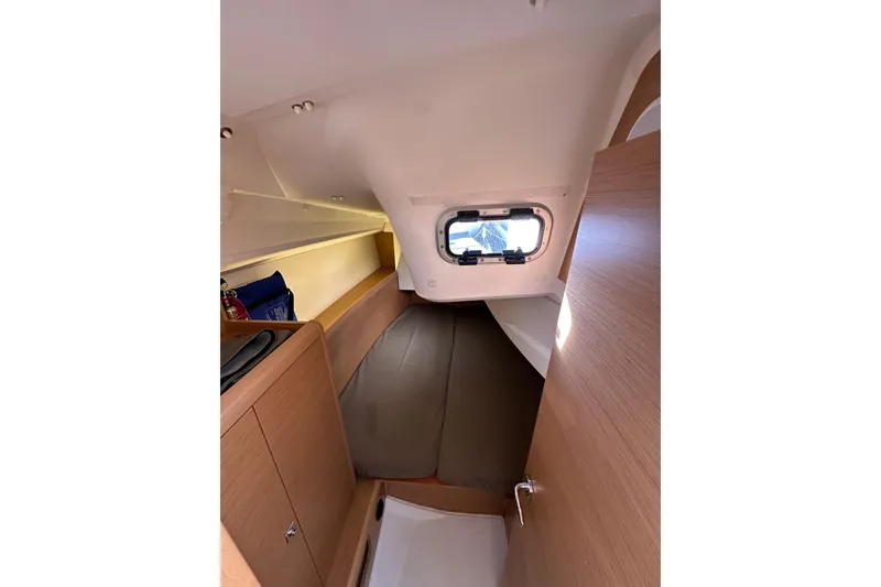 Slide: The Image of Interior cabin of 2021 Jeanneau Sun Odyssey 349 sailboat, featuring cozy sleeping area. - 56