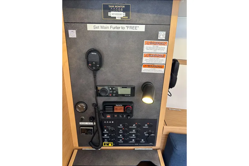 Slide: The Image of Control panel of 2021 Jeanneau Sun Odyssey 349 sailboat with communication equipment. - 61