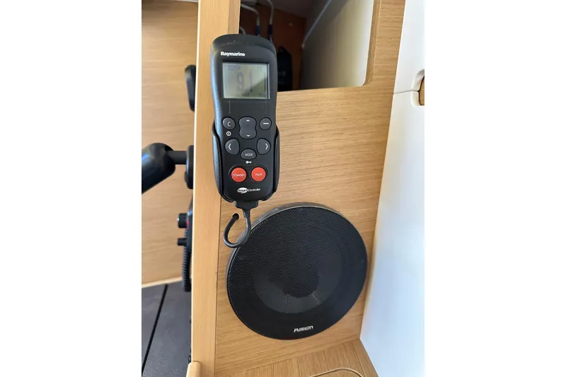 Slide: The Image of Raymarine control panel and Fusion speaker on Jeanneau Sun Odyssey 349, 2021 model. - 62