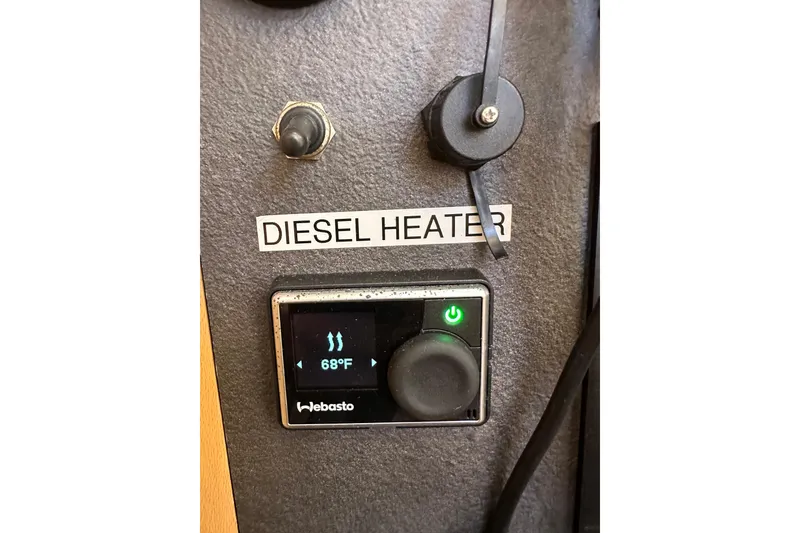 Slide: The Image of Diesel heater control panel on 2021 Jeanneau Sun Odyssey 349, displaying 68°F. - 63