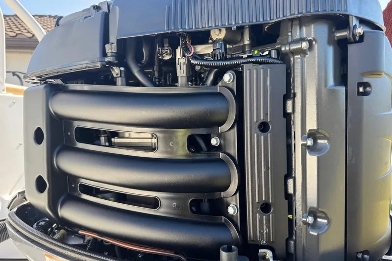 Slide: The Image of Close-up of a 2014 Sportsman Heritage 231 Center Console engine components. - 38