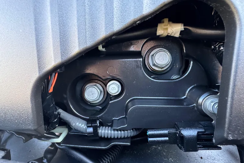 Slide: The Image of Close-up of engine components in a 2014 Sportsman Heritage 231 Center Console boat. - 39