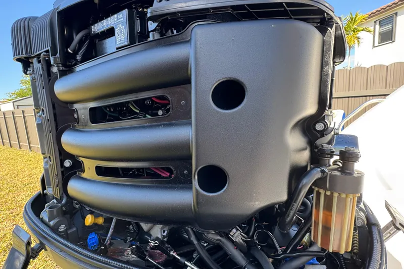 Slide: The Image of 2014 Sportsman Heritage 231 Center Console engine close-up, showcasing intricate mechanical details. - 42