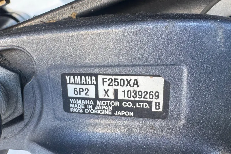 Slide: The Image of Yamaha F250XA engine label on 2014 Sportsman Heritage 231 Center Console boat. - 43