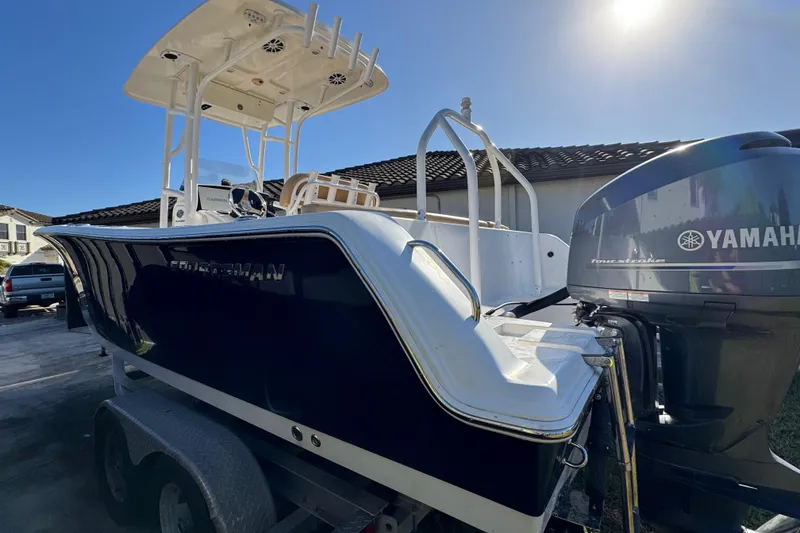 Slide: The Image of 2014 Sportsman Heritage 231 Center Console boat with Yamaha engine on trailer. - 7