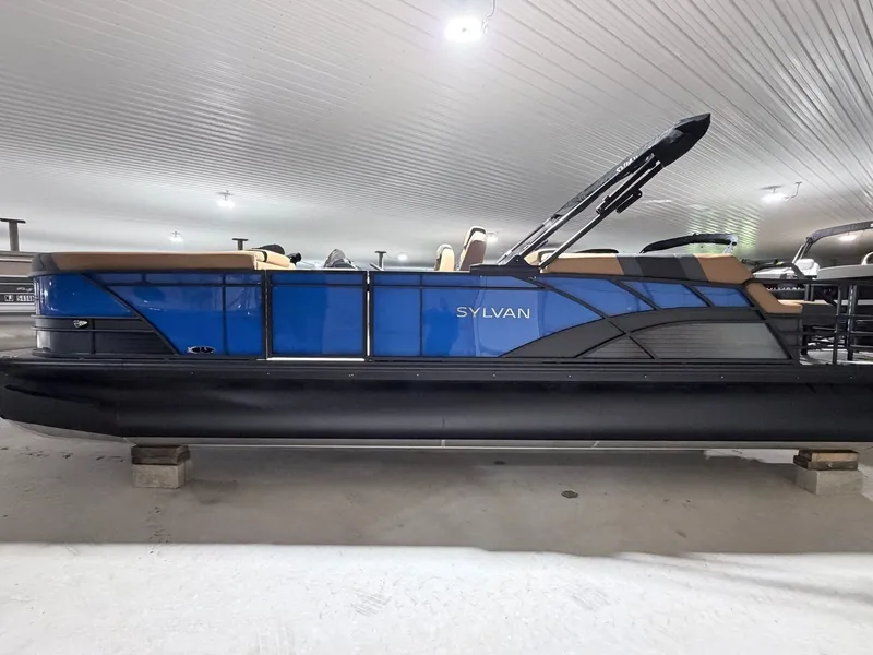 Slide: The Image of 2026 Sylvan L5 LZ DH pontoon boat in a storage facility. - 24