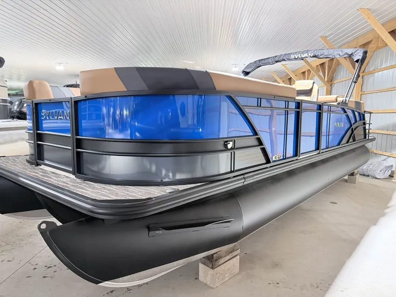Slide: The Image of 2026 Sylvan L5 LZ DH pontoon boat in a storage facility. - 7