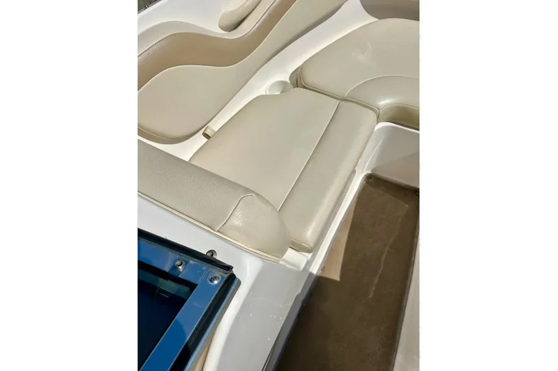 Slide: The Image of 2003 Chaparral 183 SS boat interior with beige seating and carpeted floor. - 13