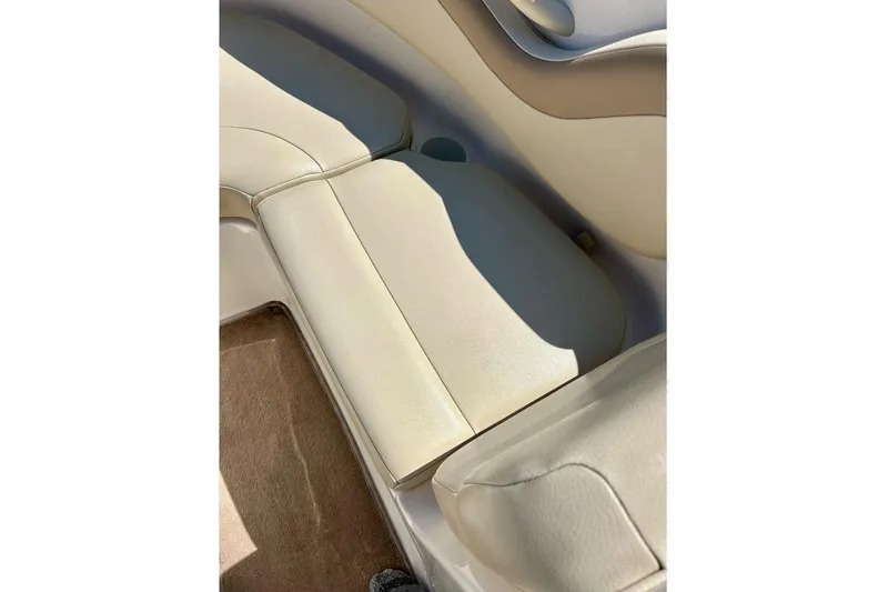 Slide: The Image of 2003 Chaparral 183 SS boat interior with beige leather seating and carpeted floor. - 15
