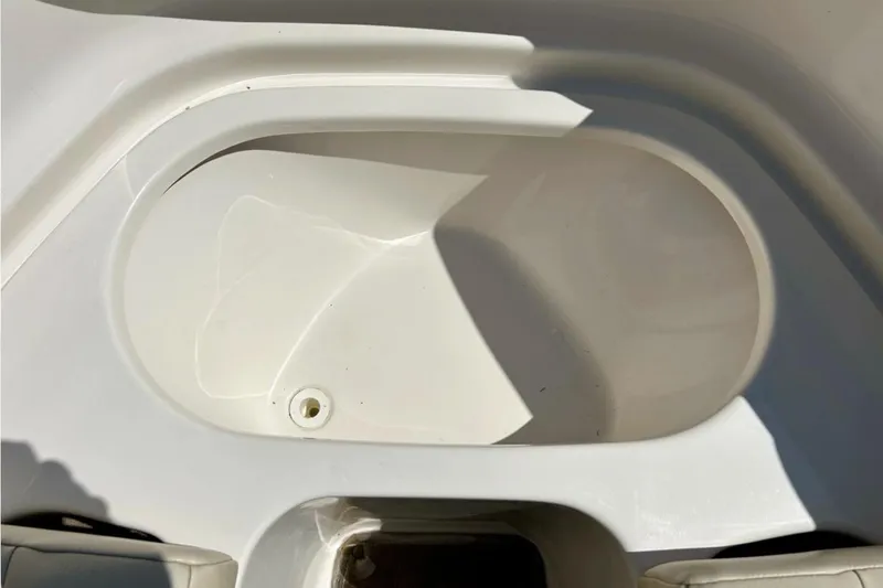 Slide: The Image of 2003 Chaparral 183 SS boat interior detail, featuring a white storage compartment. - 19