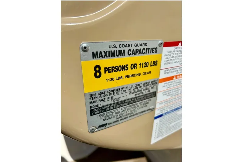 Slide: The Image of 2003 Chaparral 183 SS capacity plate, maximum 8 persons or 1120 lbs. - 25