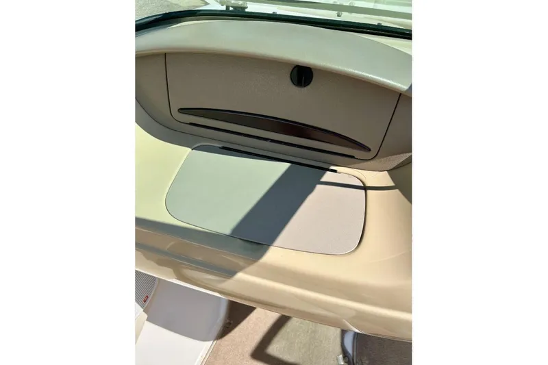 Slide: The Image of 2003 Chaparral 183 SS boat interior dashboard detail in beige and tan colors. - 26