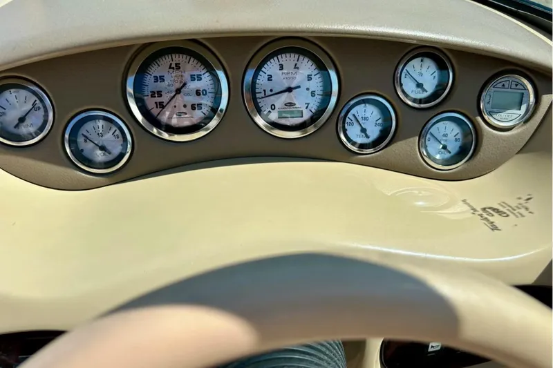 Slide: The Image of Dashboard of a 2003 Chaparral 183 SS boat with various gauges and controls. - 34