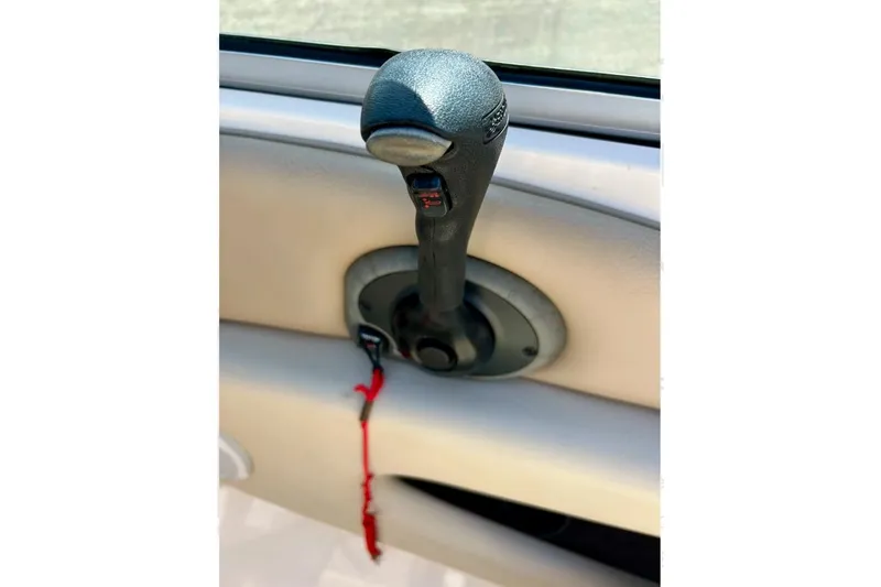 Slide: The Image of Throttle control lever in a 2003 Chaparral 183 SS boat interior. - 37