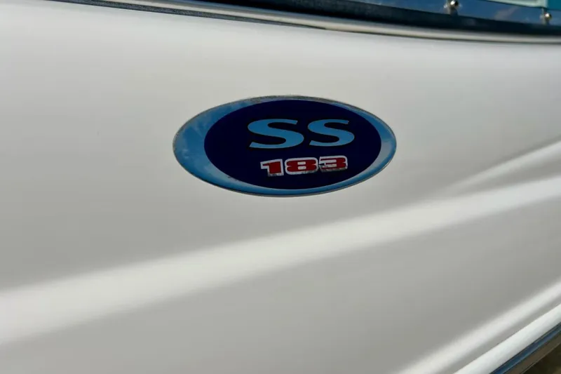 Slide: The Image of 2003 Chaparral 183 SS boat emblem on white surface. - 41