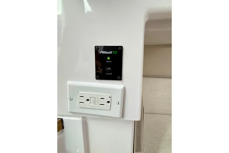 Slide: The Image of Control panel and outlet on 2025 Axopar 37 XC Cross Cabin boat interior. - 30