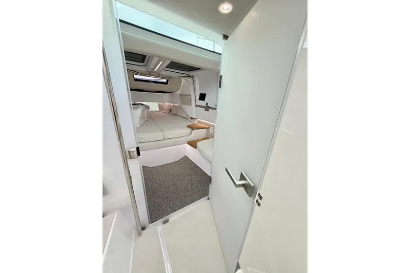 Slide: The Image of Interior view of 2025 Axopar 37 XC Cross Cabin, featuring a cozy sleeping area. - 35