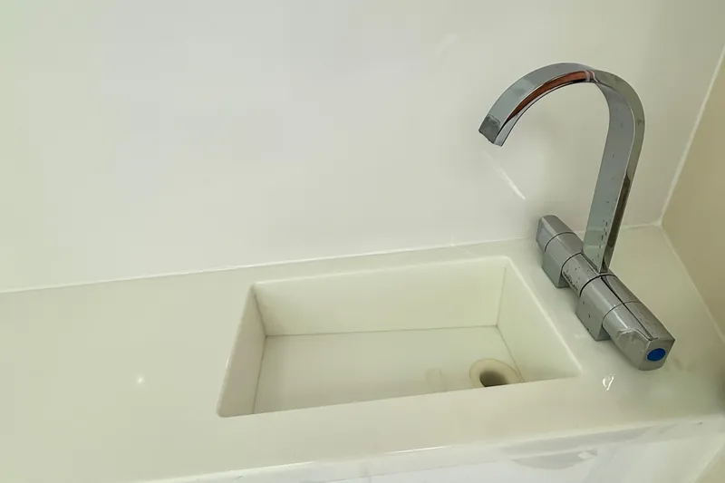 Slide: The Image of Modern sink and faucet in 2025 Axopar 37 XC Cross Cabin boat. - 37