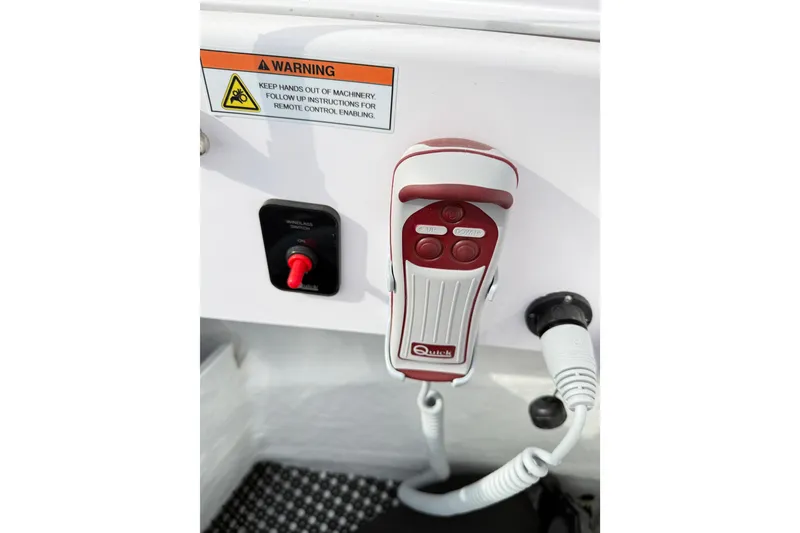 Slide: The Image of Control panel with remote and warning label on 2025 Axopar 37 XC Cross Cabin boat. - 46
