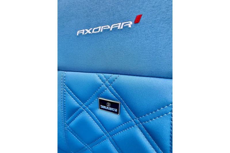 Slide: The Image of Blue quilted seat with Axopar and Brabus logos, 2025 Axopar 37 XC Cross Cabin. - 60
