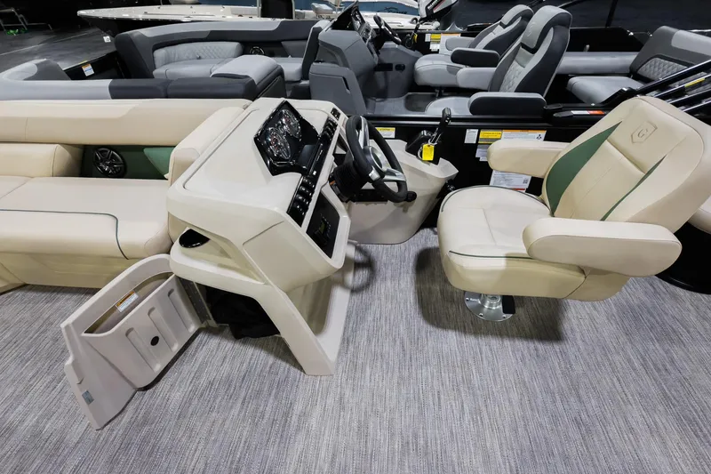 Slide: The Image of 2026 Godfrey Sweetwater 22' Tritoon interior with plush seating and modern helm controls. - 10