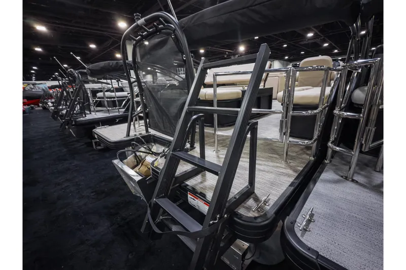 Slide: The Image of 2026 Godfrey Sweetwater 22' Tritoon with flip lounge, showcased indoors. - 20