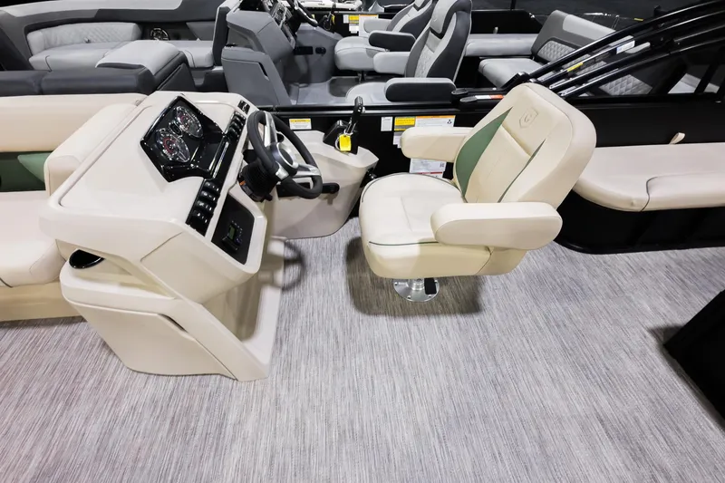 Slide: The Image of Captain's chair and console of 2026 Godfrey Sweetwater 22' Tritoon boat. - 9