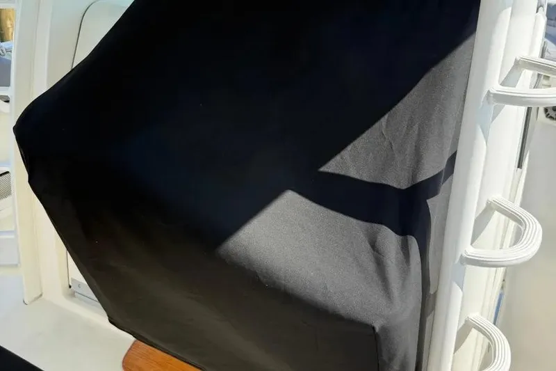 Slide: The Image of Covered console on a 2024 Boston Whaler 380 Outrage boat. - 12