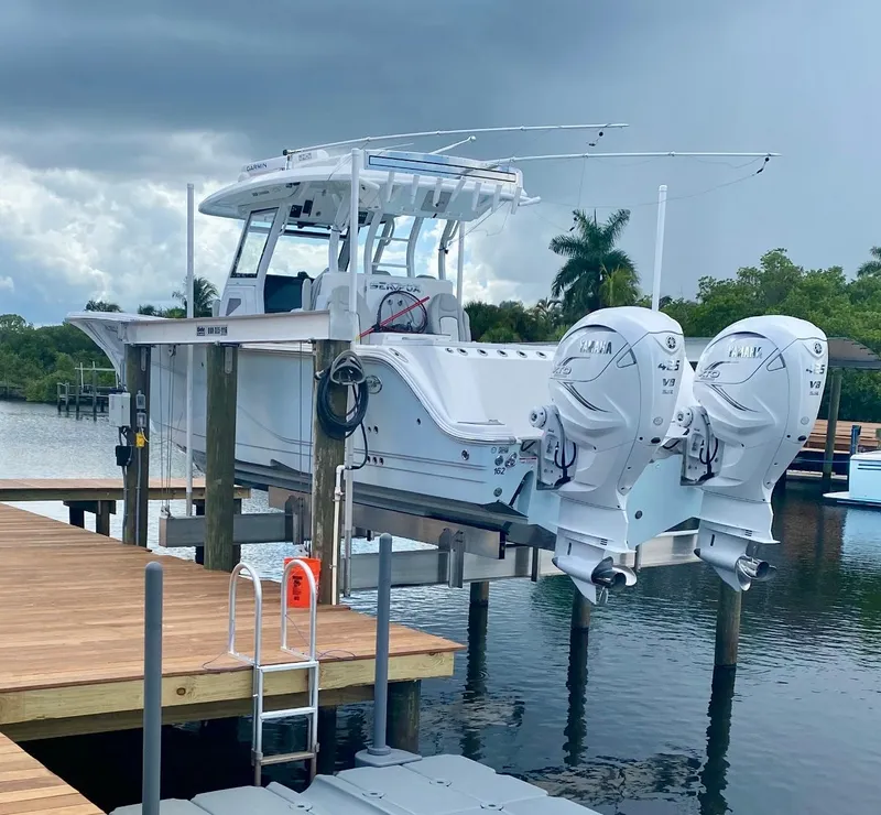 The Image of 2021 Sea Fox 368 Commander boat on lift with twin Yamaha outboard engines. - 0